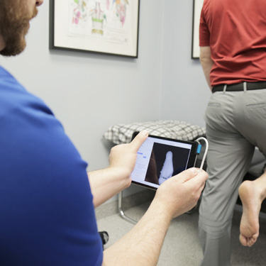 Patient getting foot exam