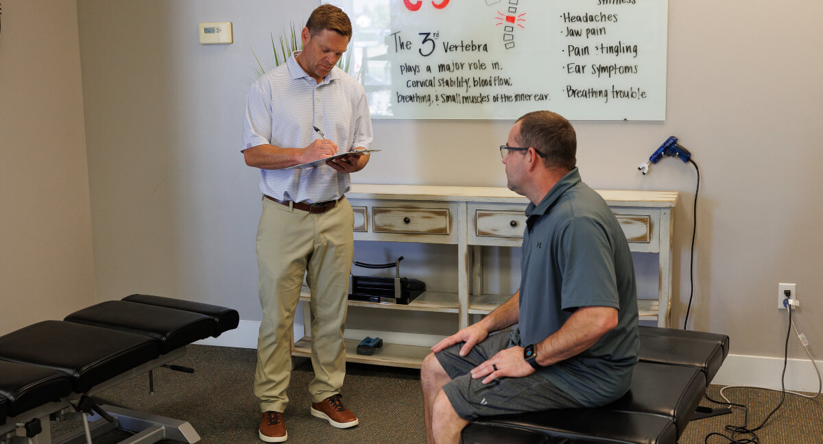 Omaha chiropractor in consultation with a patient