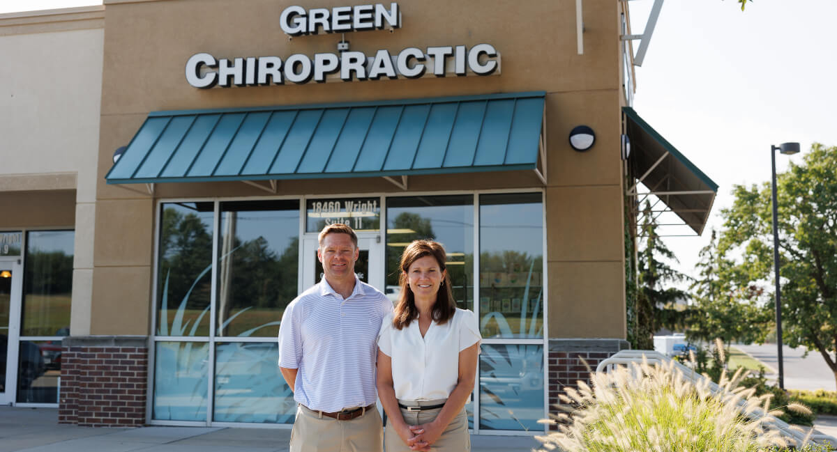 Green Chiropractic chiropractors standing in front of the office