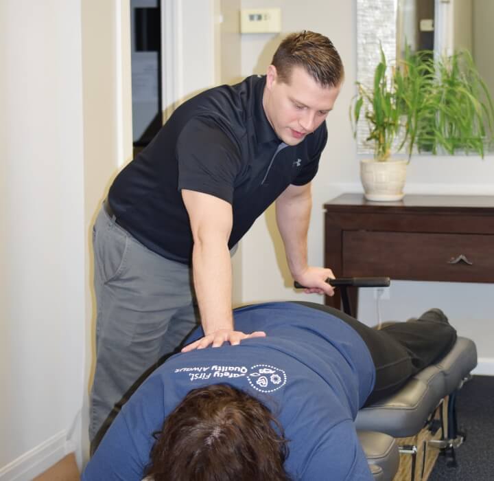 chiropractor adjusting patient