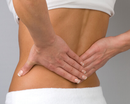 Patient receiving chiropractic treatment for low back pain