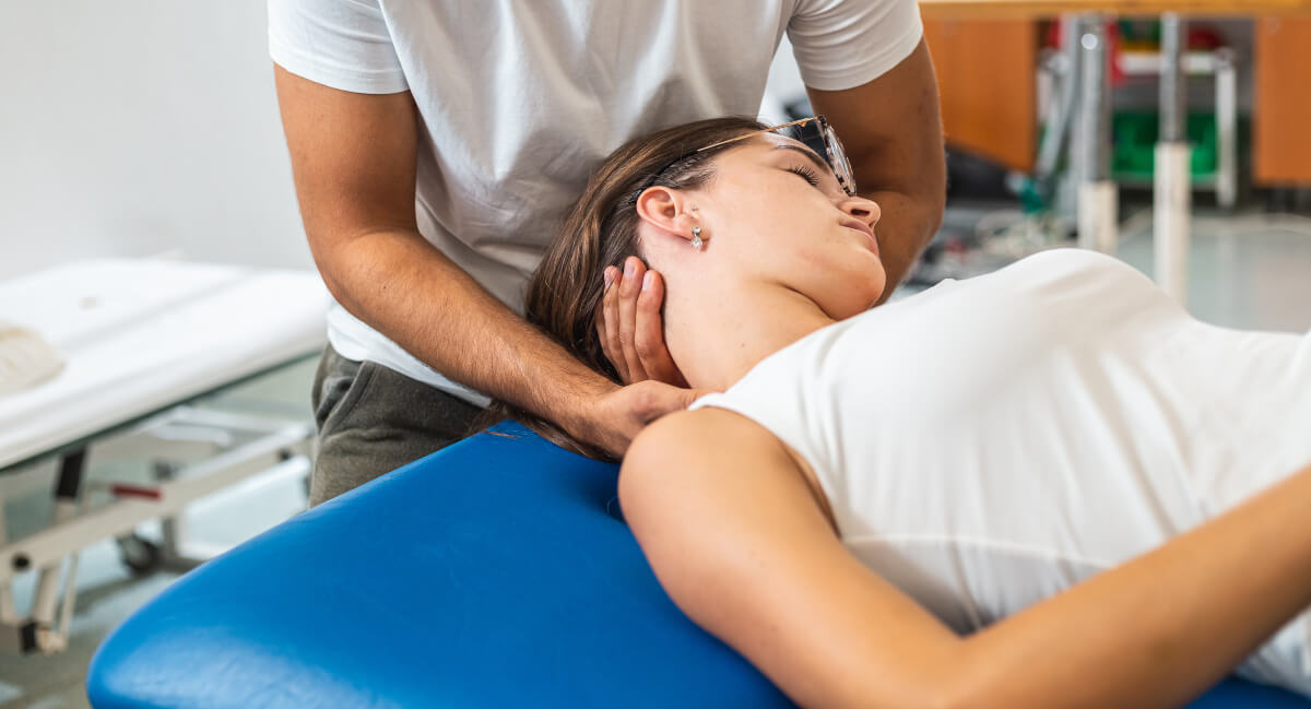 Patient receiving a chiropractic neck adjustment