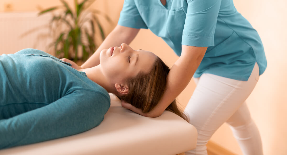 Female patient receiving a chiropractic adjustment