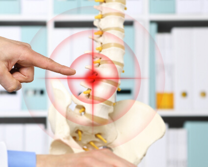 Chiropractor pointing at spine