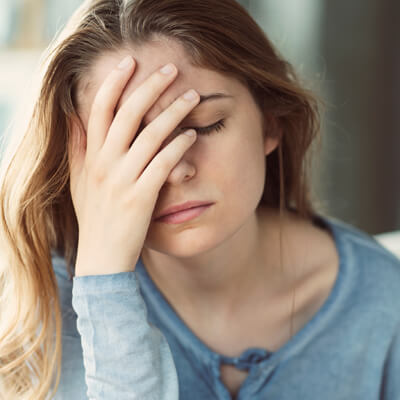 woman with face pain