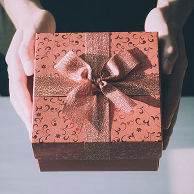 woman holding a holiday gift box