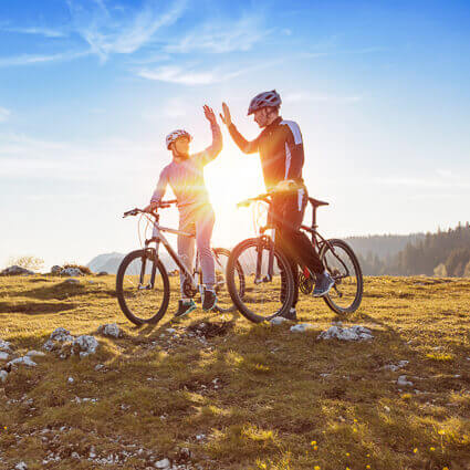 high-five-with-bikes-in-beautiful-scenery-sq