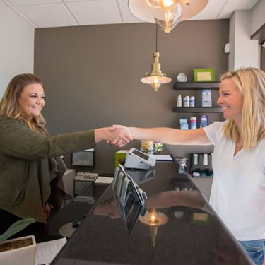 Shaking hands in reception area