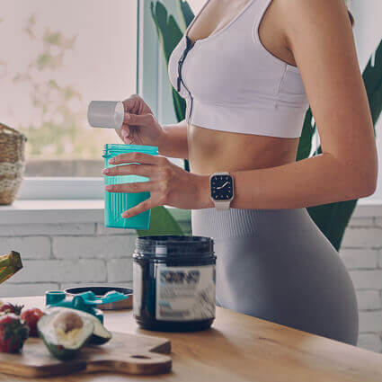 woman-pouring-protein-powder-into-bottle-sq