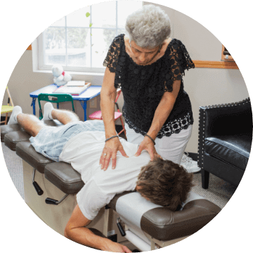 Fishers Chiropractor Dr. Pennella adjusting patient's back