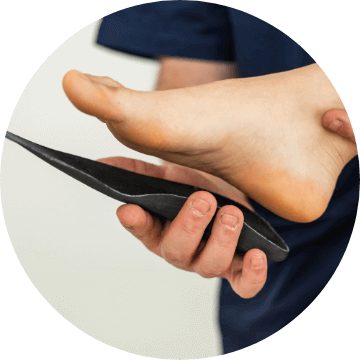 holding orthotic by foot