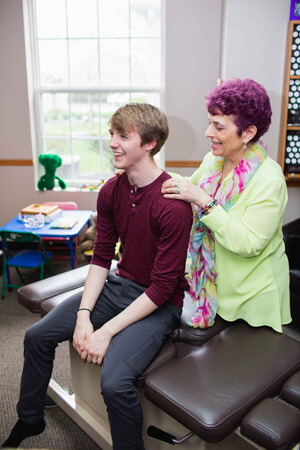 Dr Pennella examining young man