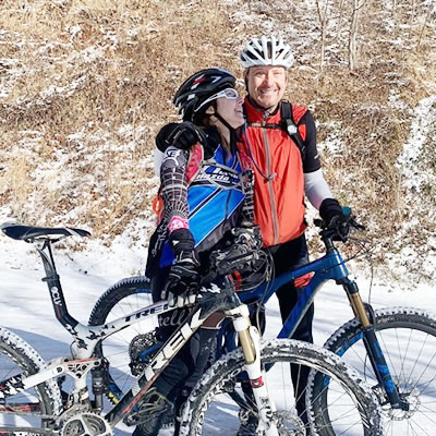 Dr Brown and wife biking on winter