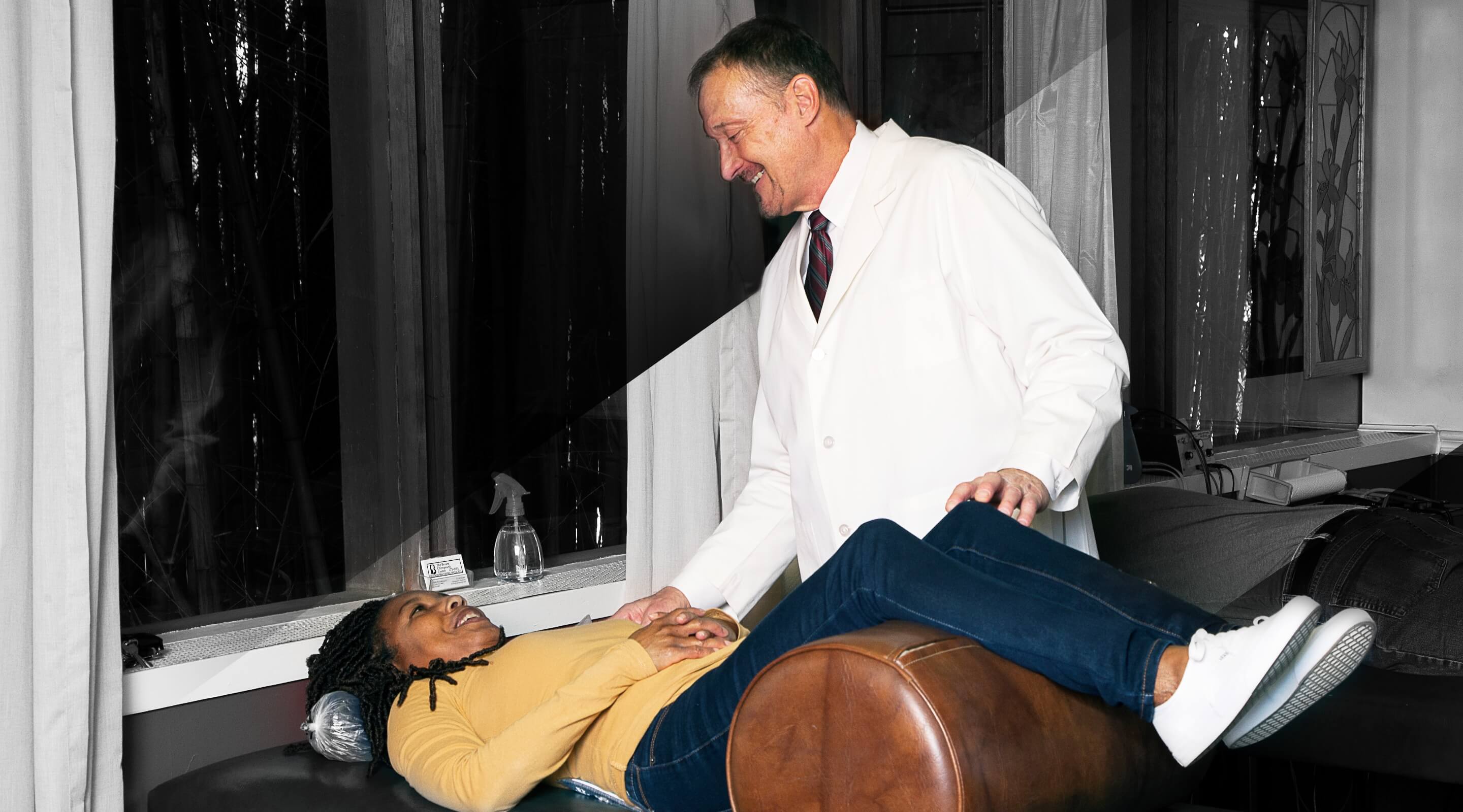 person laying on adjusting table