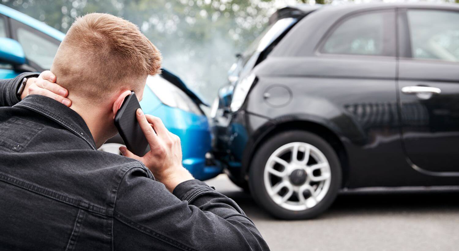 Man holding neck after a car accident