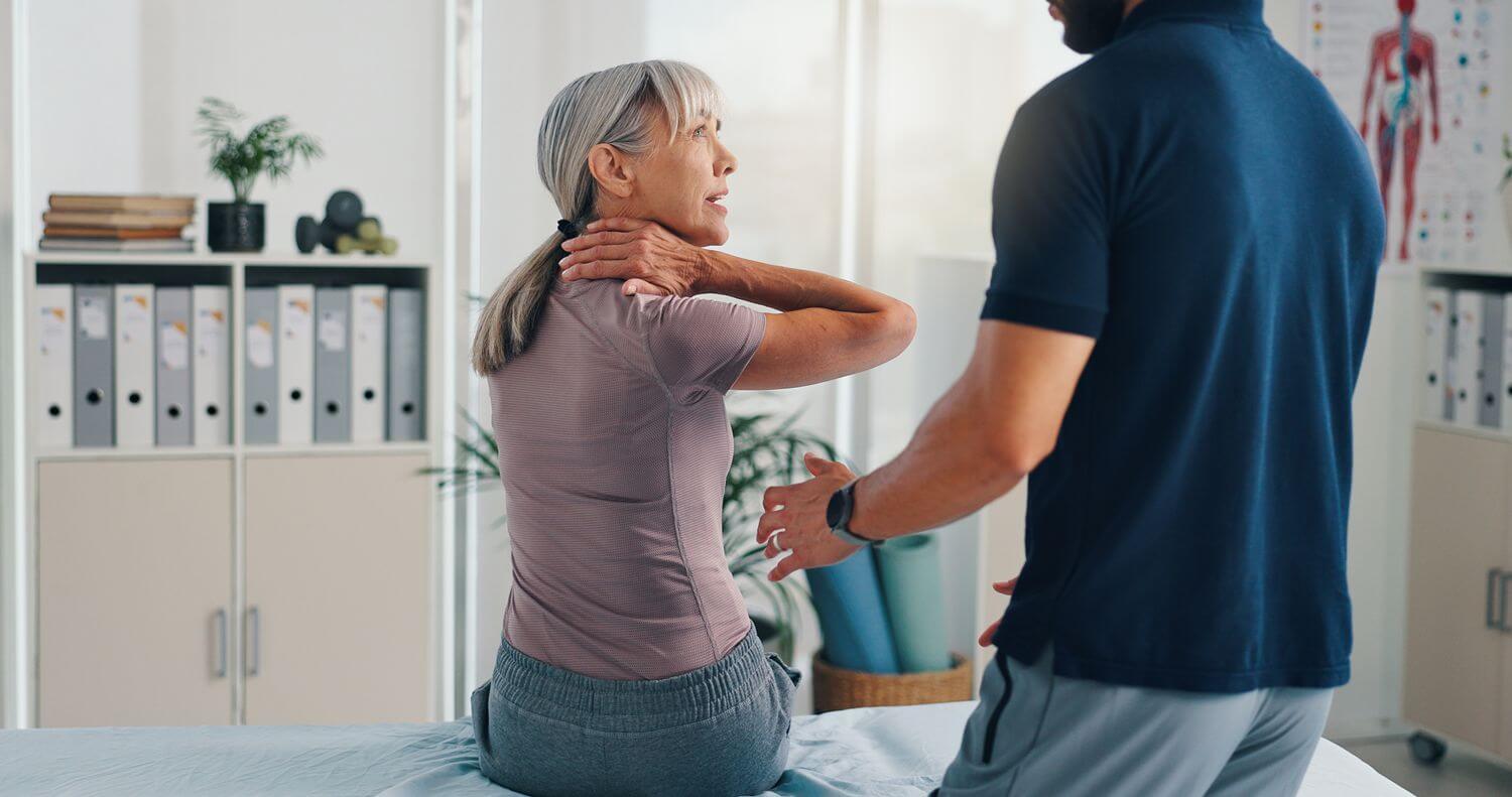 Neck pain chiropractor helping patient