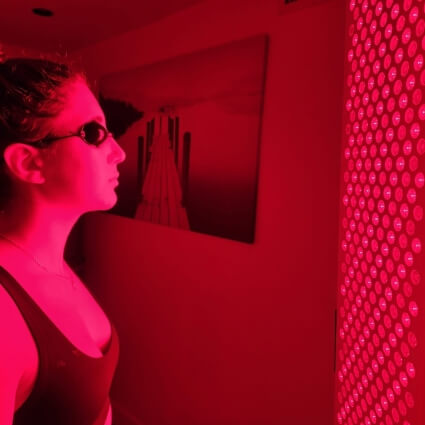 person during red light therapy