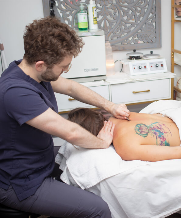 Dr. Ben massaging patient