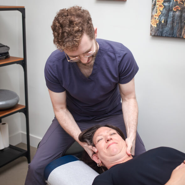 Dr. Ben adjusting patient