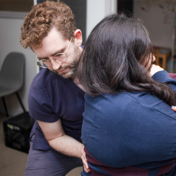 Dr. Ben adjusting patient back