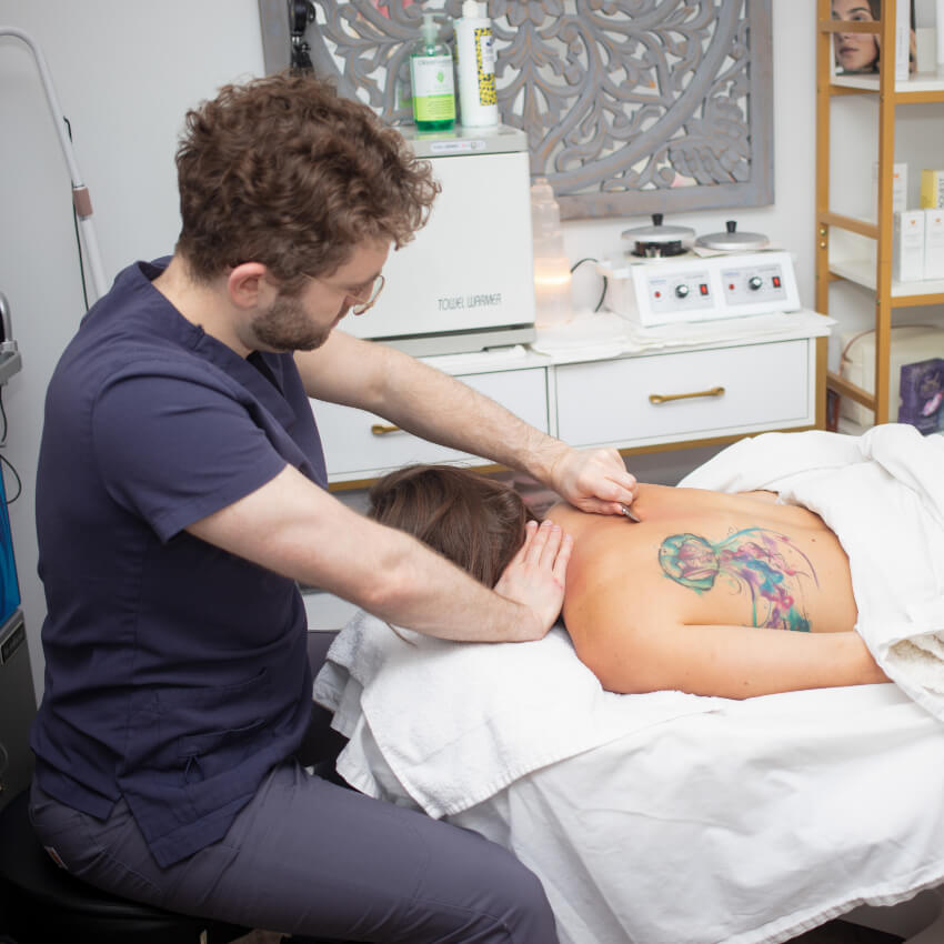 Hands On Health Family Chiropractic patient having back massaged