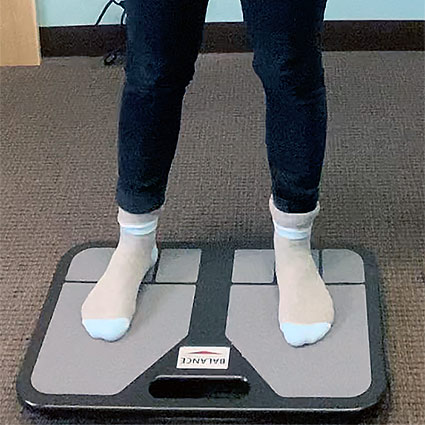 patient on a balance training device