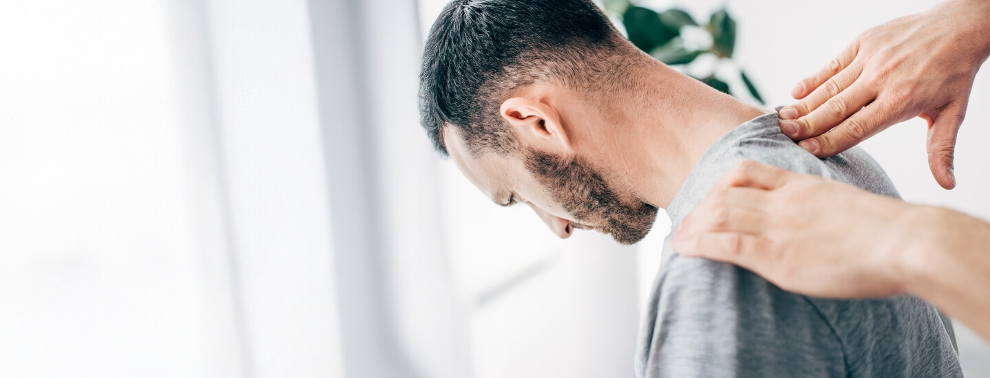 Chiropractic adjustment used on male patient's back