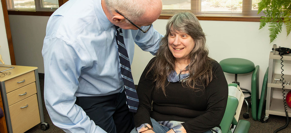 Dr Freedman talking with patient