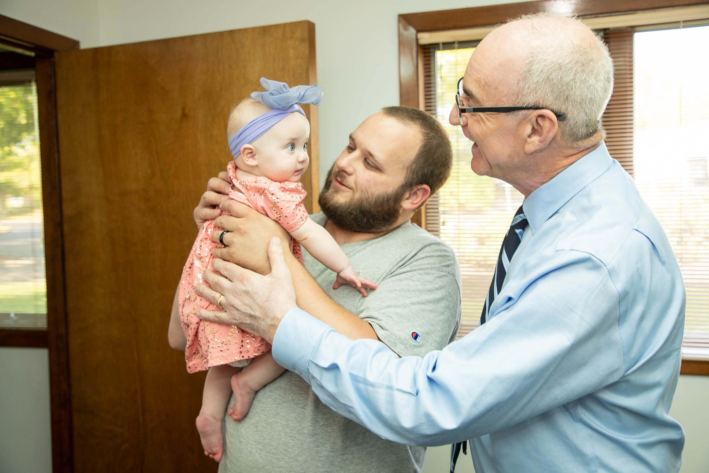 doctor with baby and dad