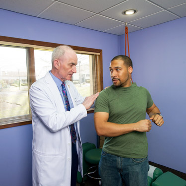 Doc examining patient posture