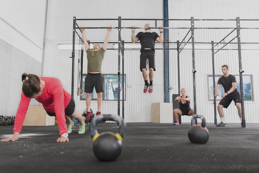 crossfit athletes workout in the gym