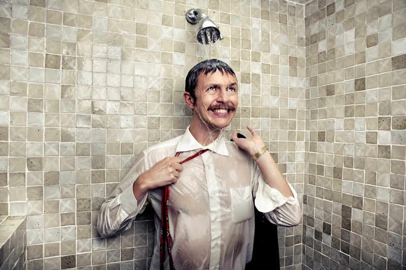 Man taking cold shower