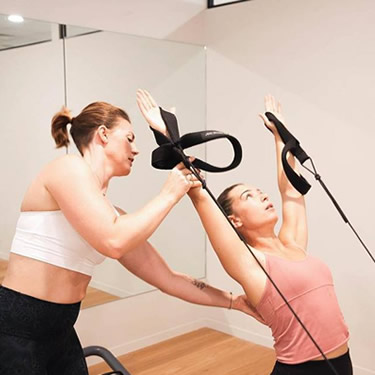 Physiotherapist West Perth helping patient stretch