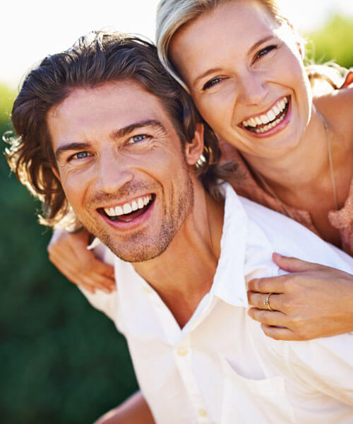  man and woman smiling