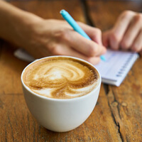 Cup of coffee sitting on table