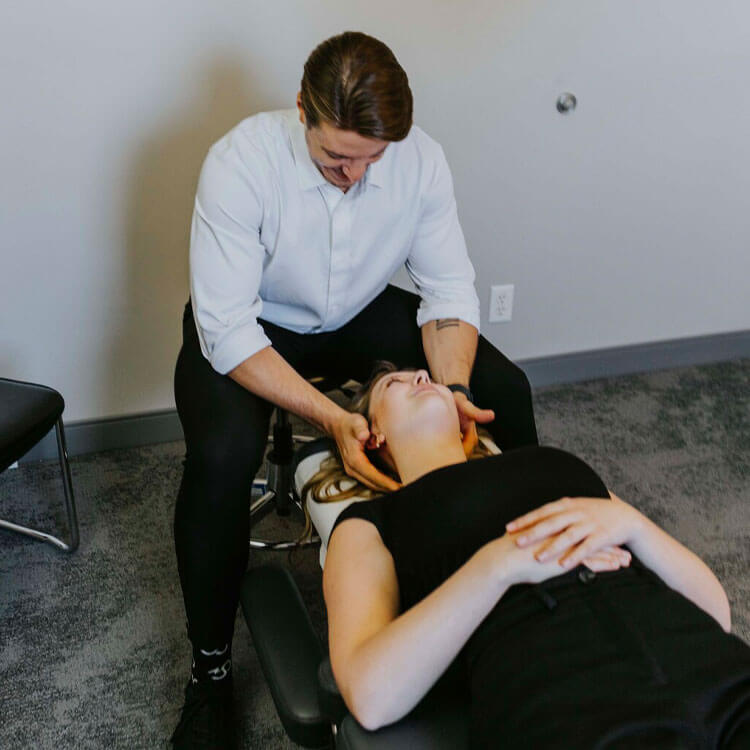 Dr. checking patient's neck