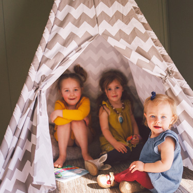 children playing in tent