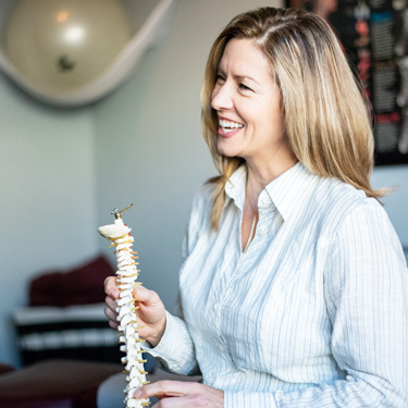 Dr. Kathy with spine model
