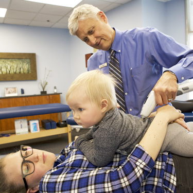 Dr. Shepherd adjusting a child.