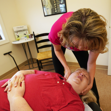 Dr. Erin adjusting woman