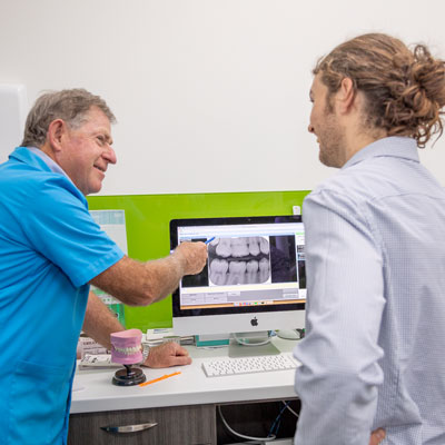 Dentist Discussing X-Ray