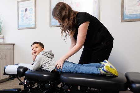 Woodbury chiropractor adjusting a pediatric patient
