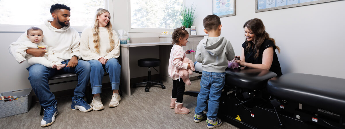 Woodbury family in a chiropractic consultation
