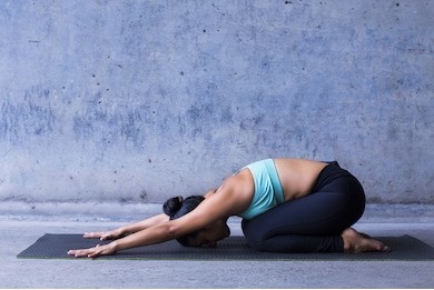 woman in child's pose