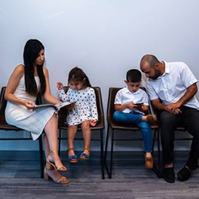 family-in-waiting-room-close-up