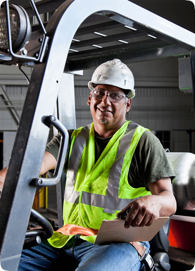 man in hard hat driving machine equipment