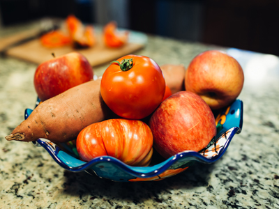 a bowl of fresh fruit and veggies