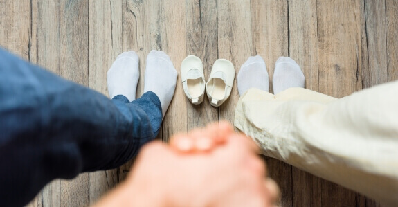 family feet and baby shoes