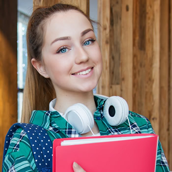 teen student smiling with headphone