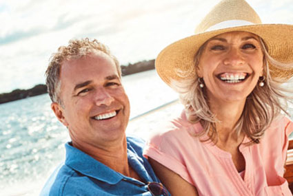 smiling middle aged couple in a boat